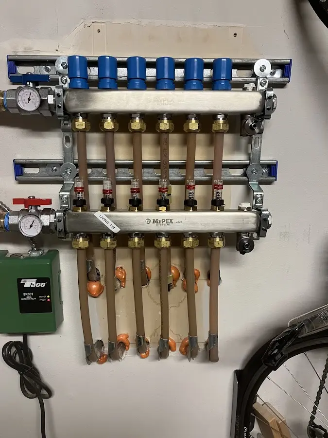 Plumber performing Water Heater Repair at a residential property in Quantico Base